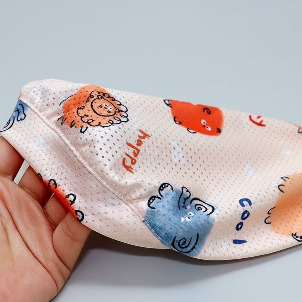 Frenchie Family Co. light pink mesh dog cooling vest with cartoon animal print and "happy" text.